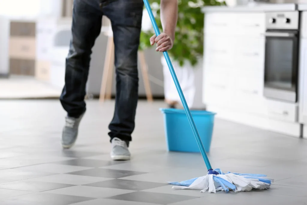man mopping the floor
